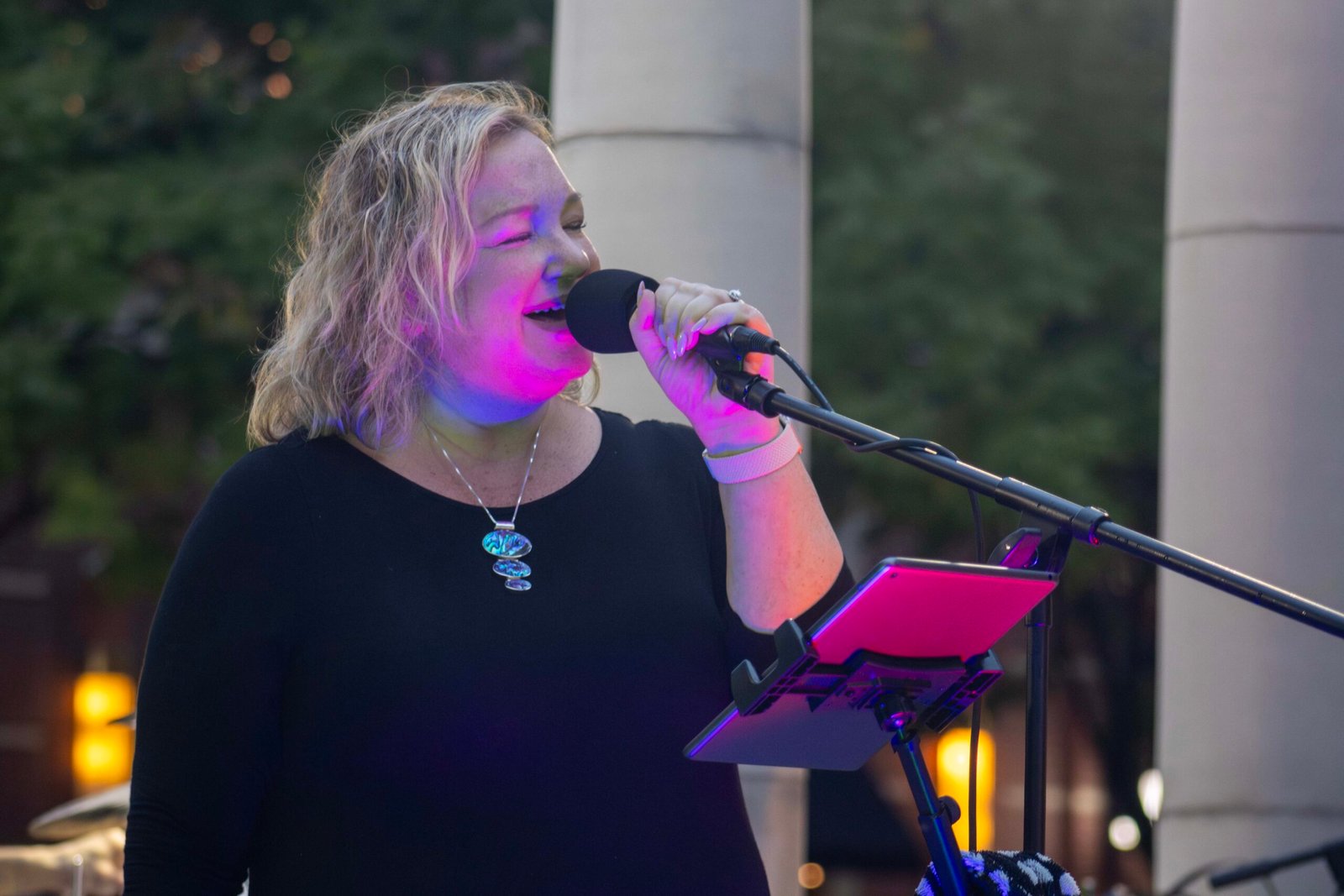 Woman performing at an outdoor concert