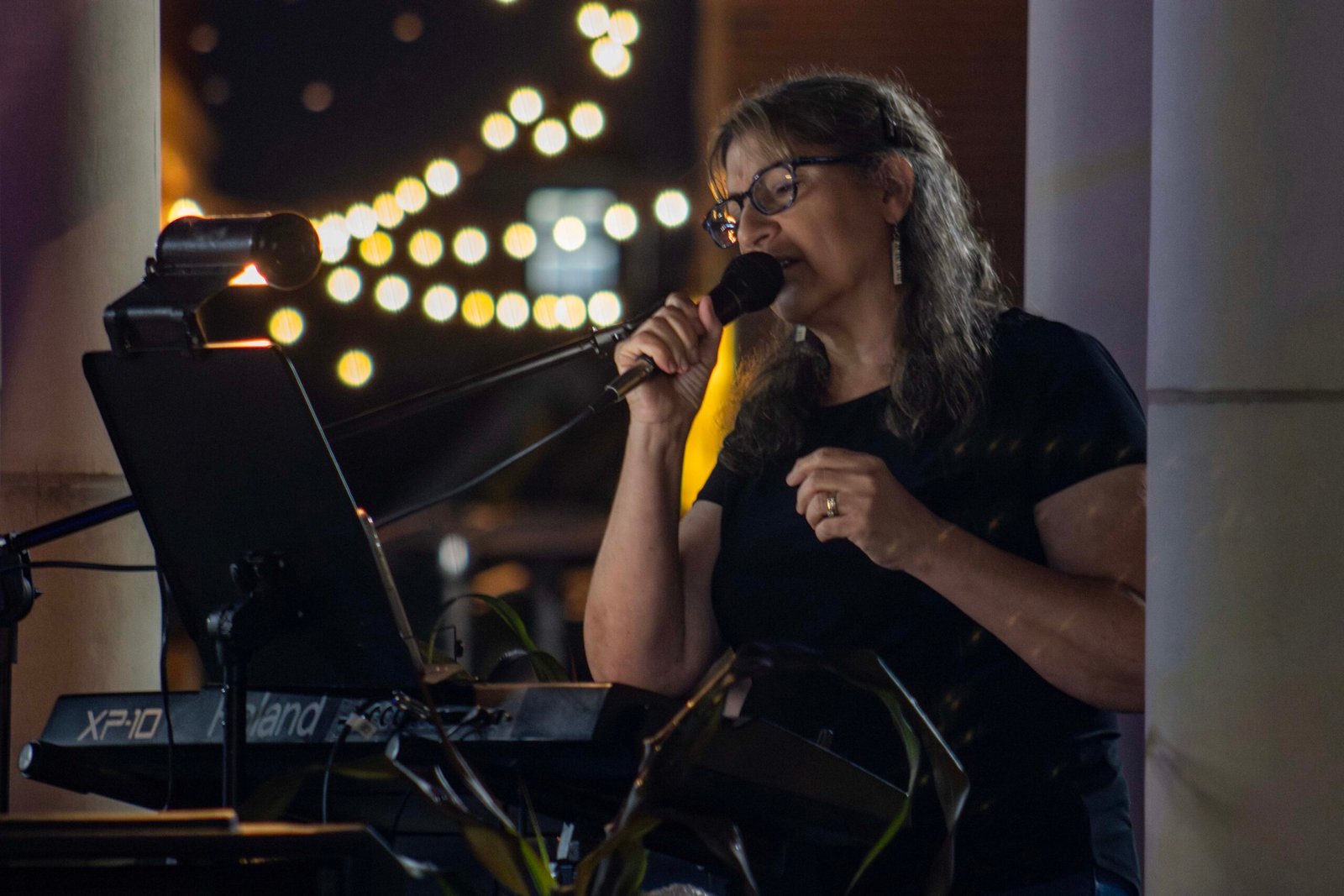 Woman performing at an outdoor concert
