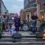 Band performing at an outdoor concert.