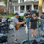 Band performing at an outdoor concert.