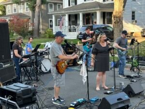 Band performing at an outdoor concert.
