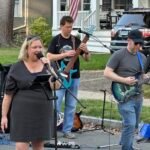 Band performing at an outdoor concert.