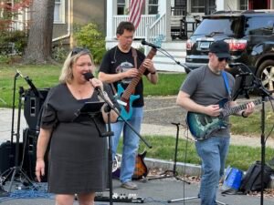 Band performing at an outdoor concert.