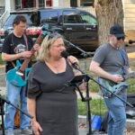 Band performing at an outdoor concert.