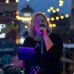 Woman performing at an outdoor concert