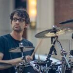 Man performing at an outdoor concert.