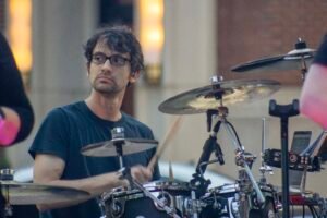 Man performing at an outdoor concert.