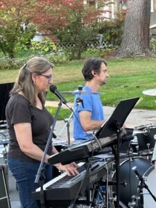 Band performing at an outdoor concert.