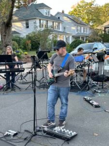 Man performing at an outdoor concert.