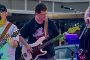 Man performing at an outdoor concert.