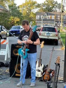 Man performing at an outdoor concert.
