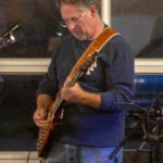 Man performing at a concert.