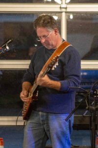 Man performing at a concert.