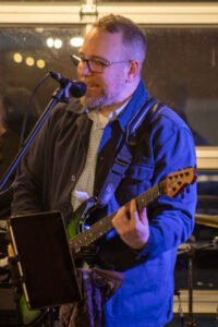 Man performing at a concert.