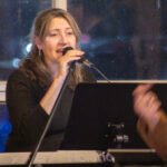 Woman performing at a concert.