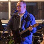 Man performing at a concert.