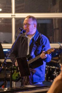 Man performing at a concert.