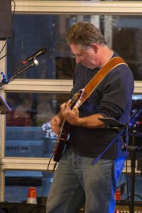 Man performing at a concert.