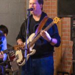 Man performing at a concert.