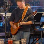 Man performing at a concert.