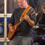 Man performing at a concert.