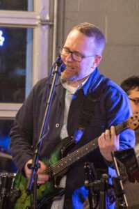 Man performing at a concert.