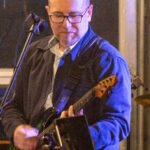 Man performing at a concert.