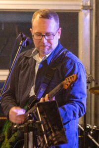 Man performing at a concert.