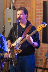 Man performing at a concert.