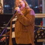 Woman performing at a concert.