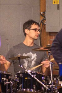 Man performing at a concert.