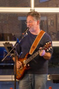 Man performing at a concert.