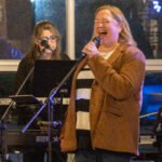 Women performing at a concert.