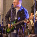 Man performing at a concert.