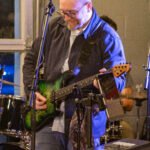 Man performing at a concert.