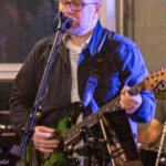 Man performing at a concert.