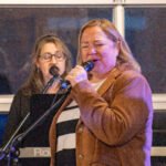 Women performing at a concert.