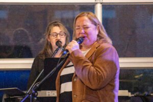 Women performing at a concert.
