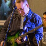 Man performing at a concert.